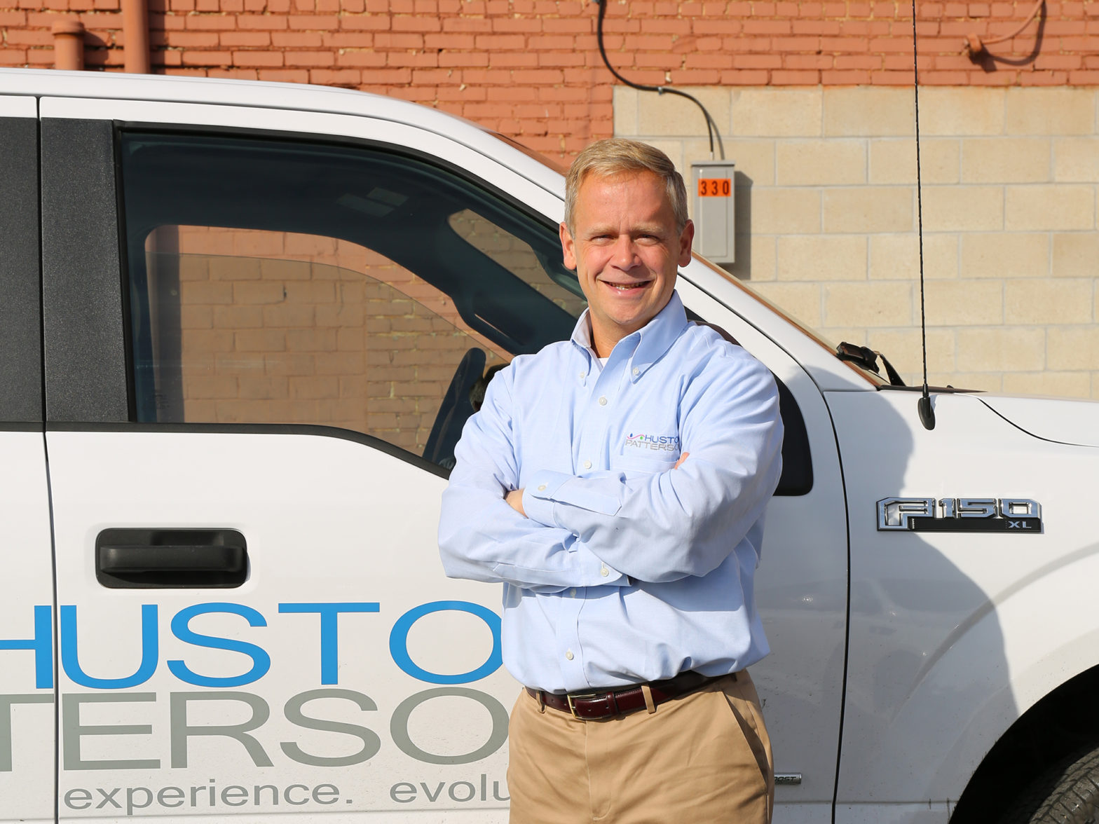 Kevin Collins in front of a Huston Patterson truck